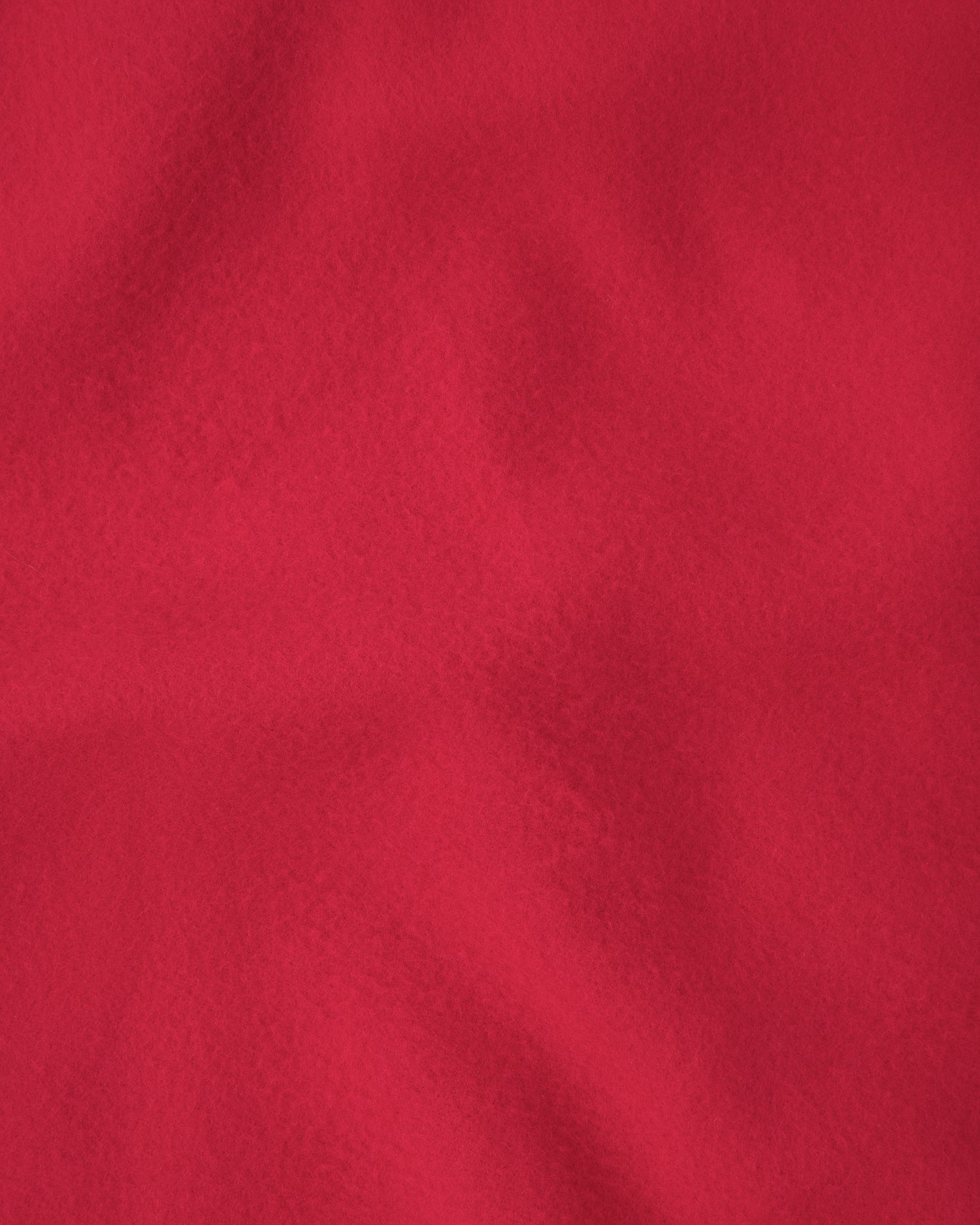 Close up of the red blanket on the Nap Mat in Blue Cherries pattern.