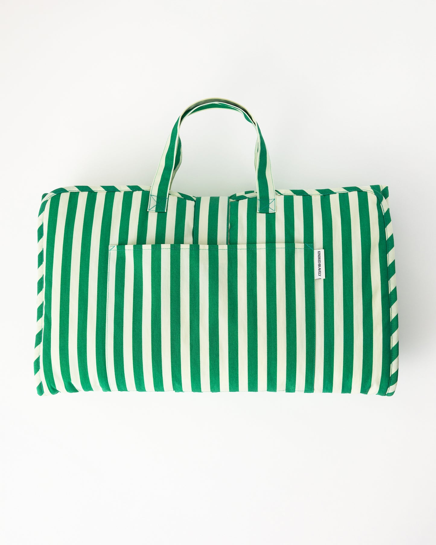 Nap Mat in Green Stripe on a beige background.