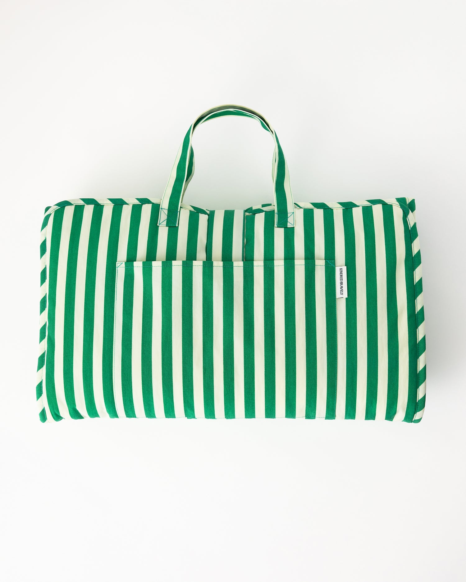 Nap Mat in Green Stripe on a beige background.