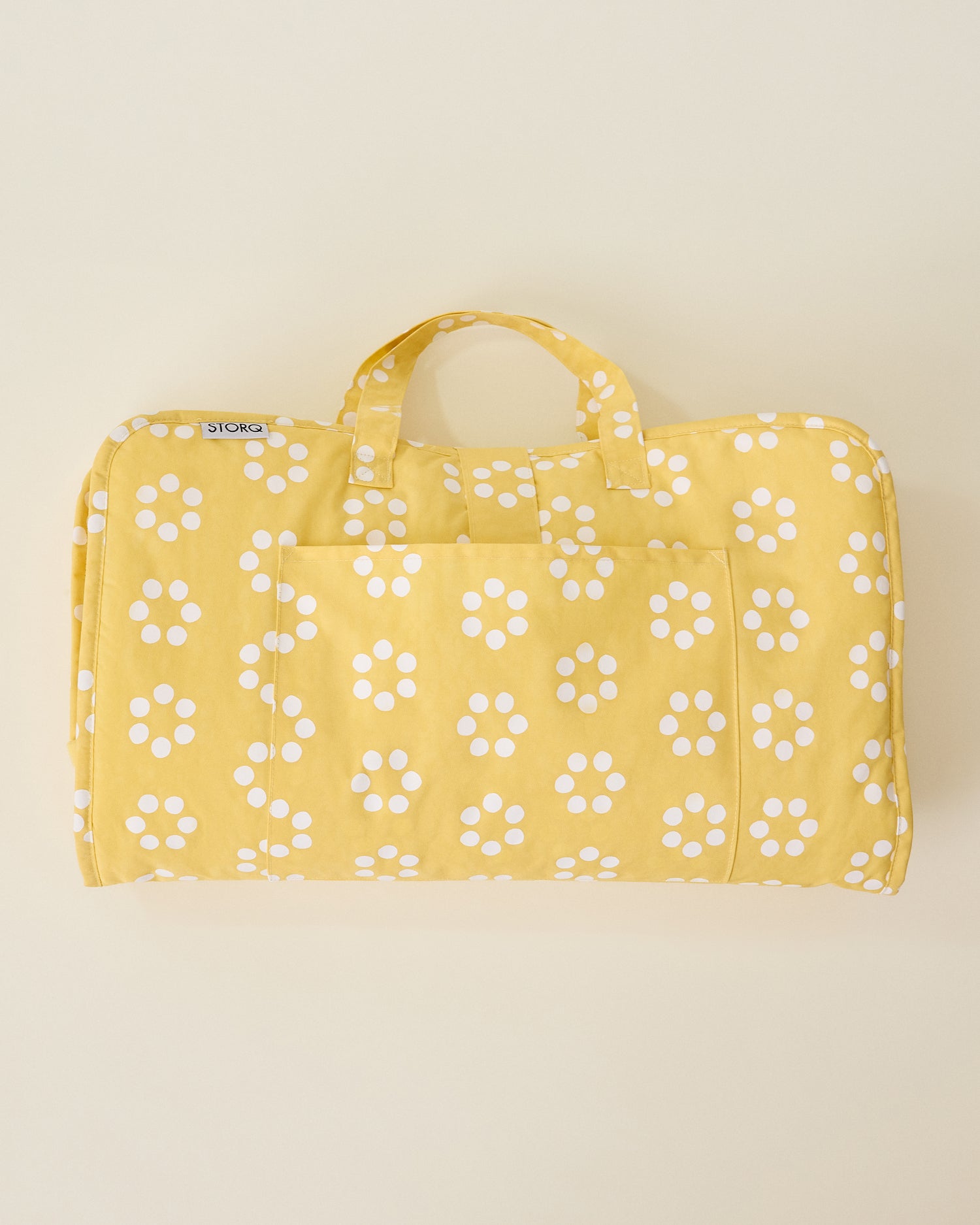 Nap Mat in Sunshine Dots on a beige background.