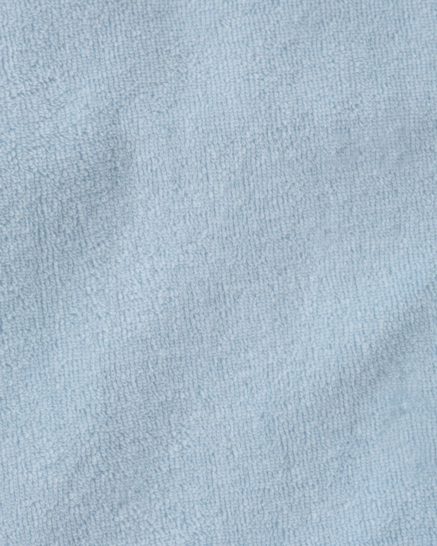 Close up of the soft material of the Hooded towel in the Newborn Bath Set in Breeze.