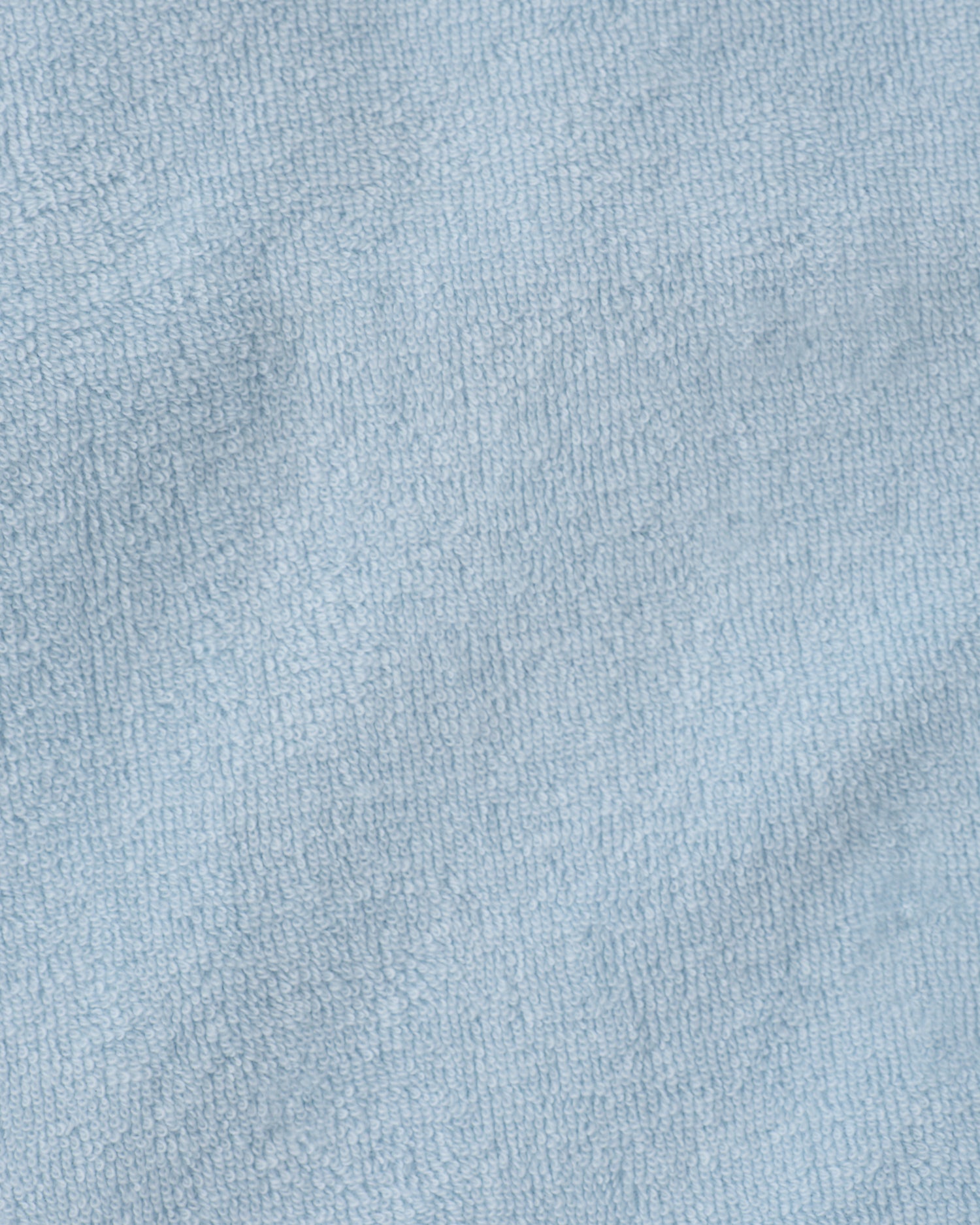 Close up of the soft material of the Hooded towel in the Newborn Bath Set in Breeze.