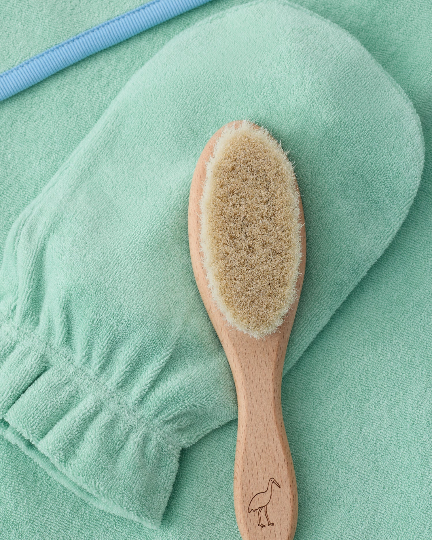 Newborn Bath Set in Mint, including hooded towel, hair brush and bath mitt.