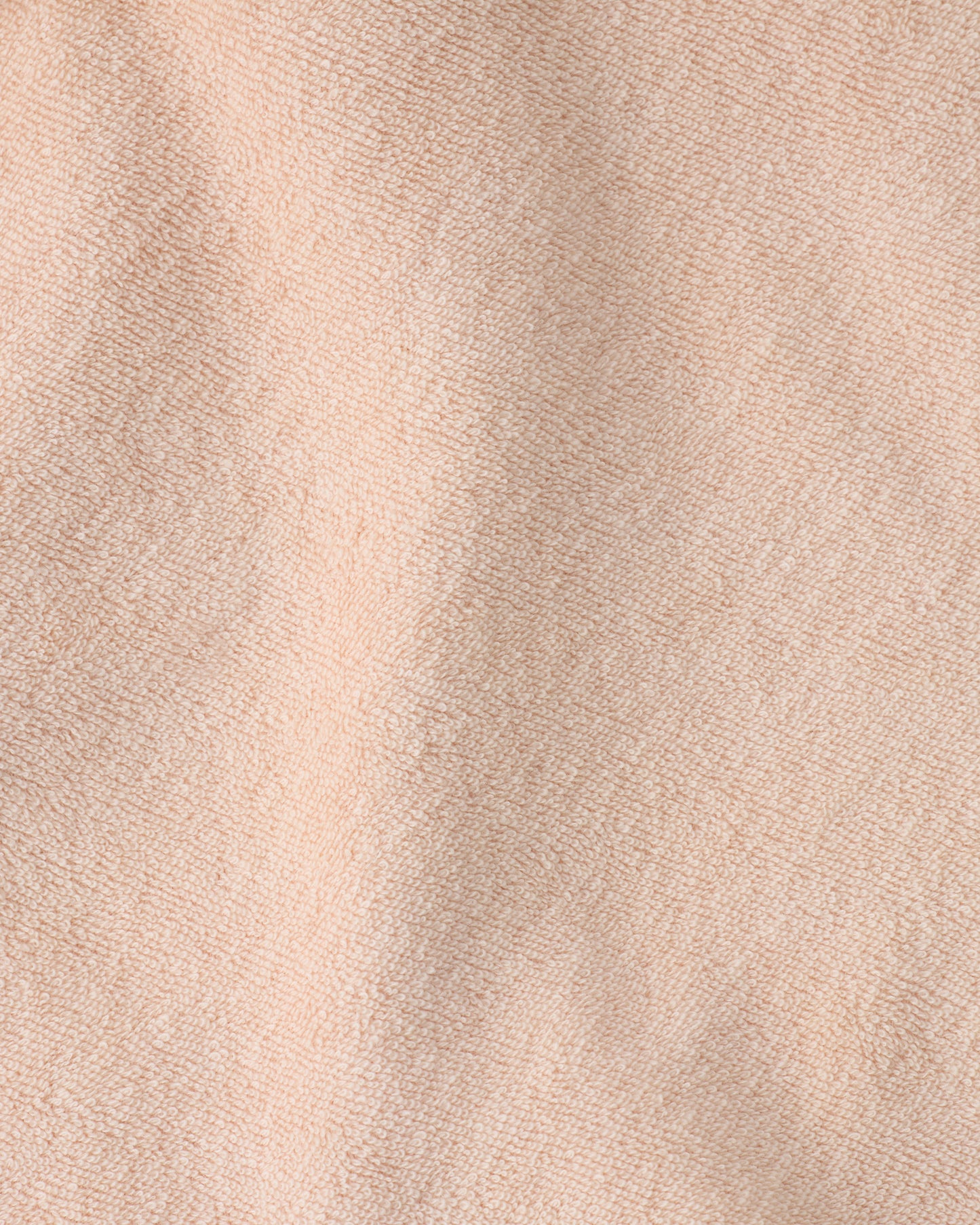 Close up of the soft material of the Newborn Bath Set in Peach Whip.