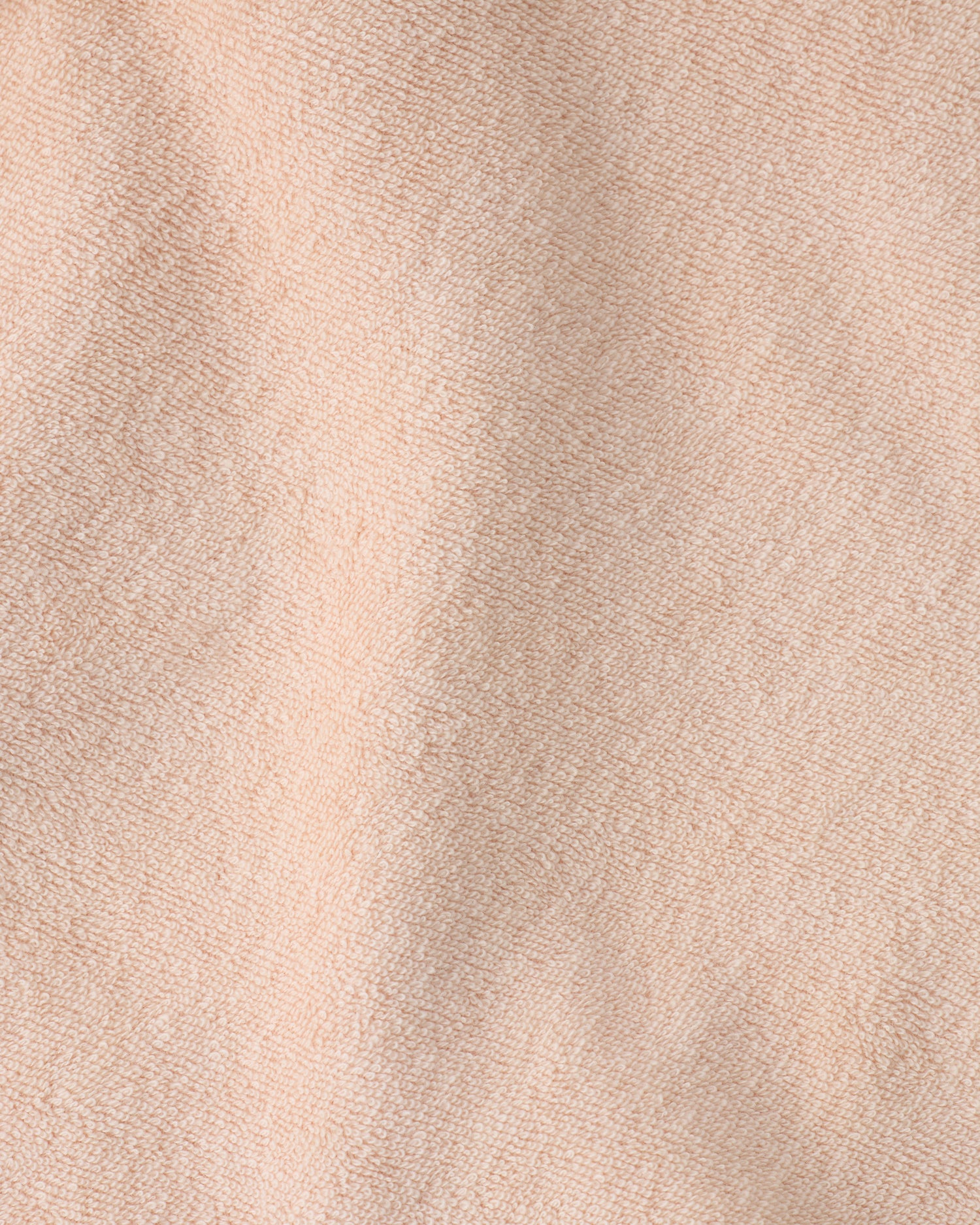 Close up of the soft material of the Newborn Bath Set in Peach Whip.