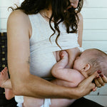Mother breastfeeding baby while wearing Sublime® Bamboo Hands-Free Pumping Longline Bra Top in Oatmeal Heather