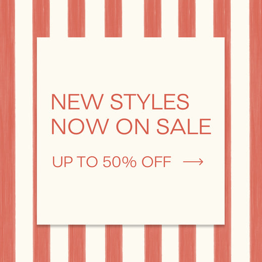 Red text on a white box over a red-stripe background: NEW STYLES NOW ON SALE! Up to 50% Off (red arrow)