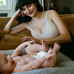 Woman wearing the Sublime® Hands-Free Pumping & Nursing Bra in beige 