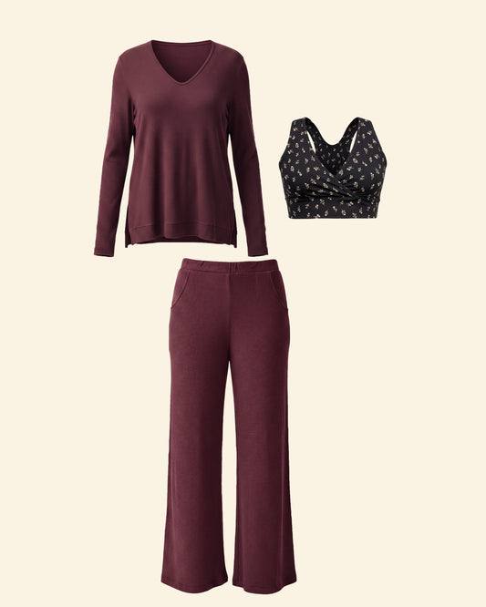 Nesting & Nursing Set on a beige background, including: French Terry Racerback Nursing & Sleep Bra in Black Wildflower, CozyKnit Wide Leg Lounge Pant and CozyKnit Maternity & Nursing V-neck Top. 