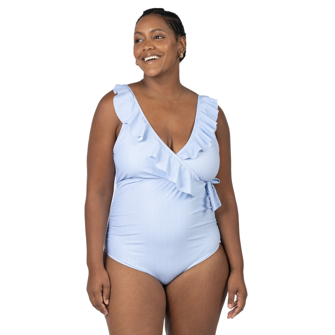 Model with her hands at her sides wearing the Ruffle Wrap Maternity & Nursing One Piece Swimsuit in Coastal Stripe @model_info:Roxanne is wearing a Large.