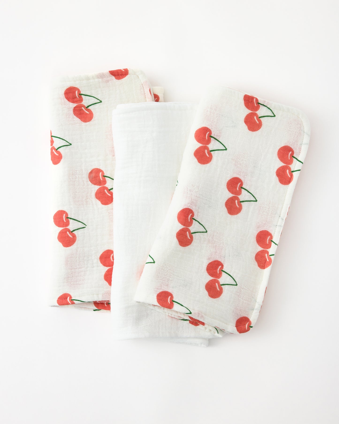 Organic Muslin Burp Cloth (3-Pack) in White Cherries on a white background.