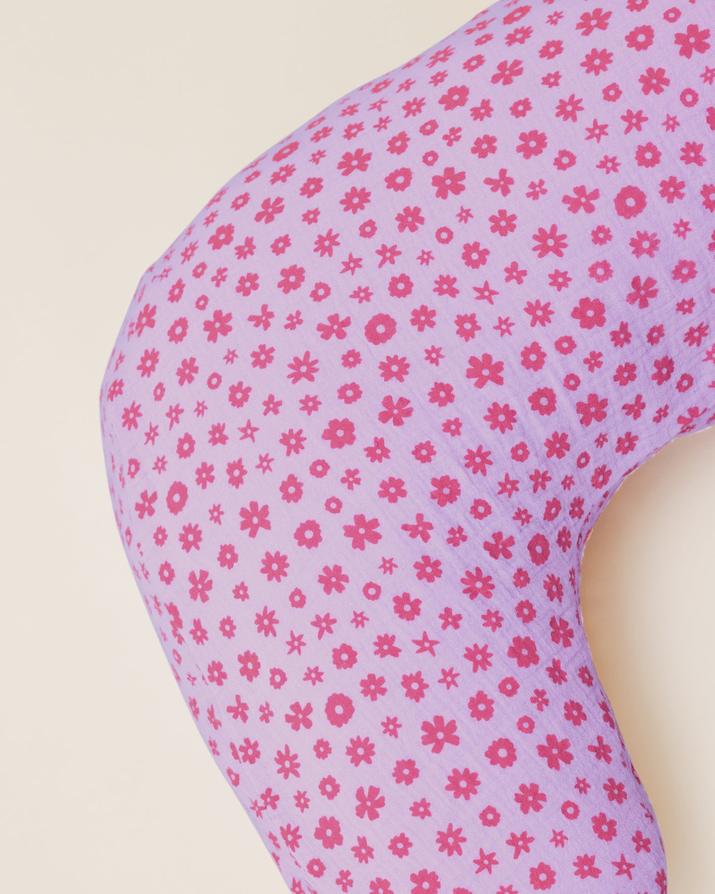 Close up of the Organic Muslin Nursing Pillow Cover in the Lavender Cosmos print