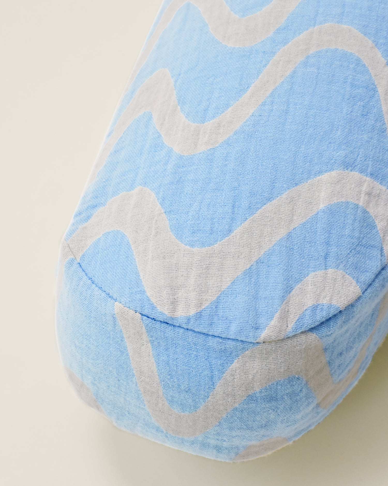 Close up of Organic Muslin Nursing Pillow Cover in the Blue Waves print