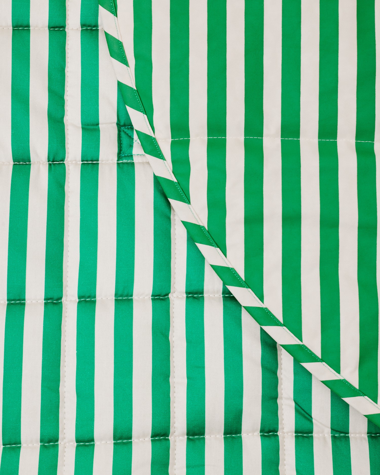 Close up of the Inside/Outside Play Mat in Green Stripe print.
