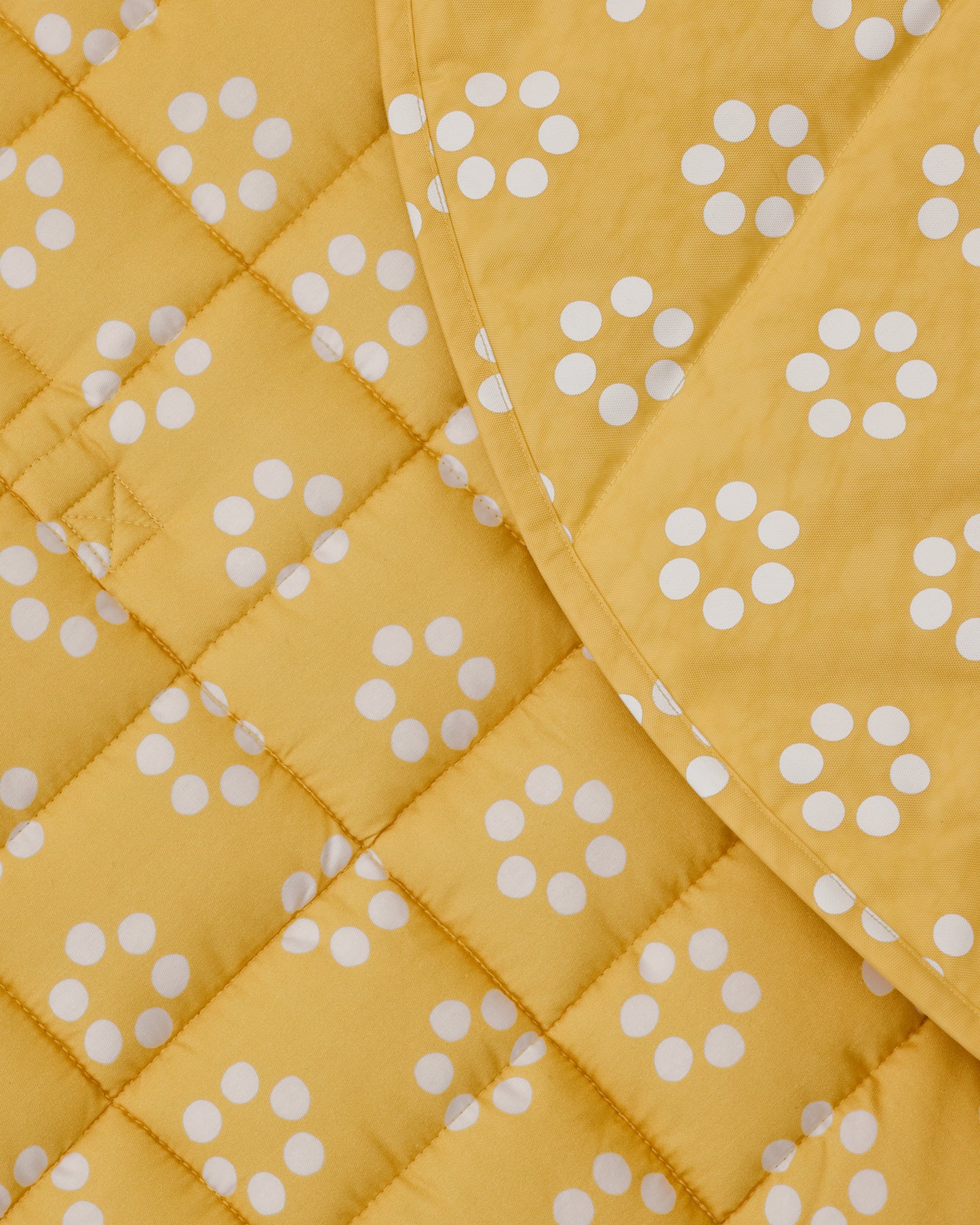Close up of the Inside/Outside Play Mat in Sunshine Dots print.