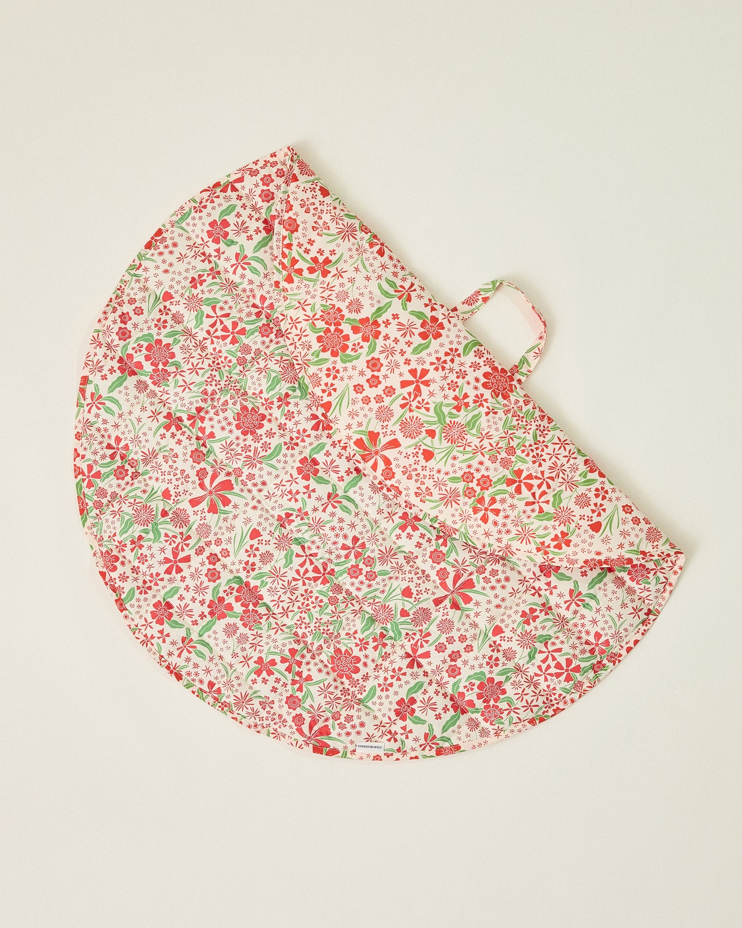 Inside/Outside Play Mat in Superbloom print, partly folded and displaying two different patterns on a beige background