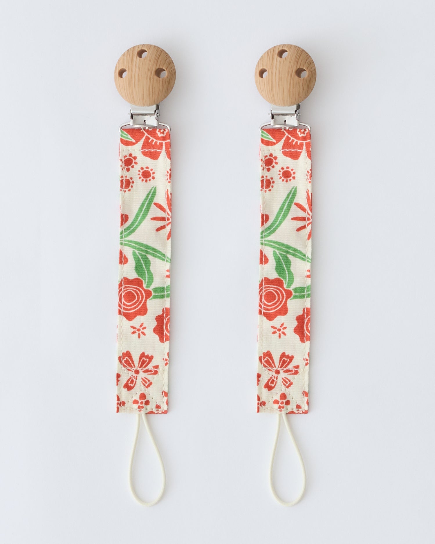 Pacifier Clip Two-Pack in Superbloom,  on a beige background.