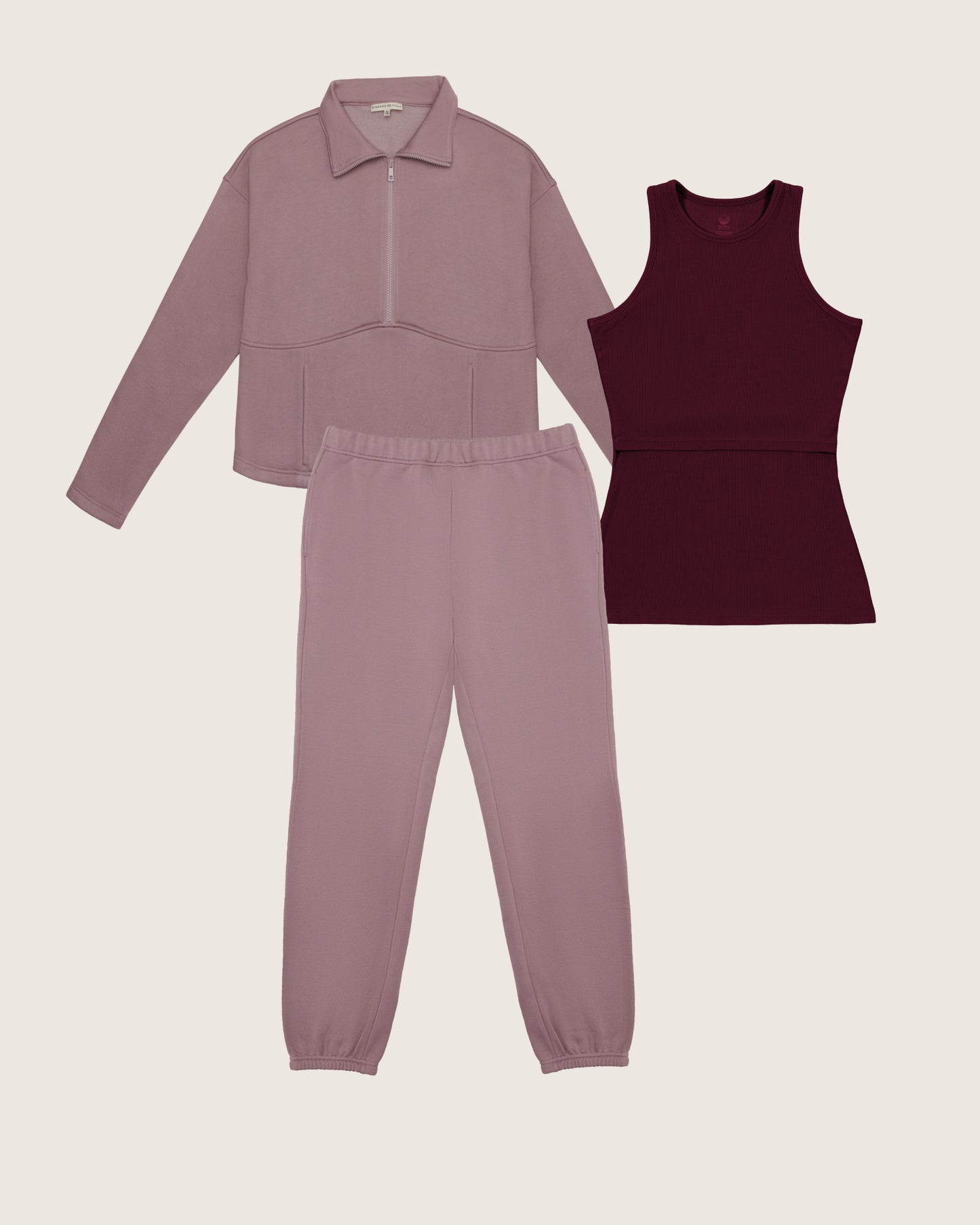 Pink tracksuit and burgundy tank top on a light beige background