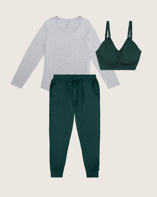 Green bra, green joggers, and light grey long-sleeve shirt on a light gray background