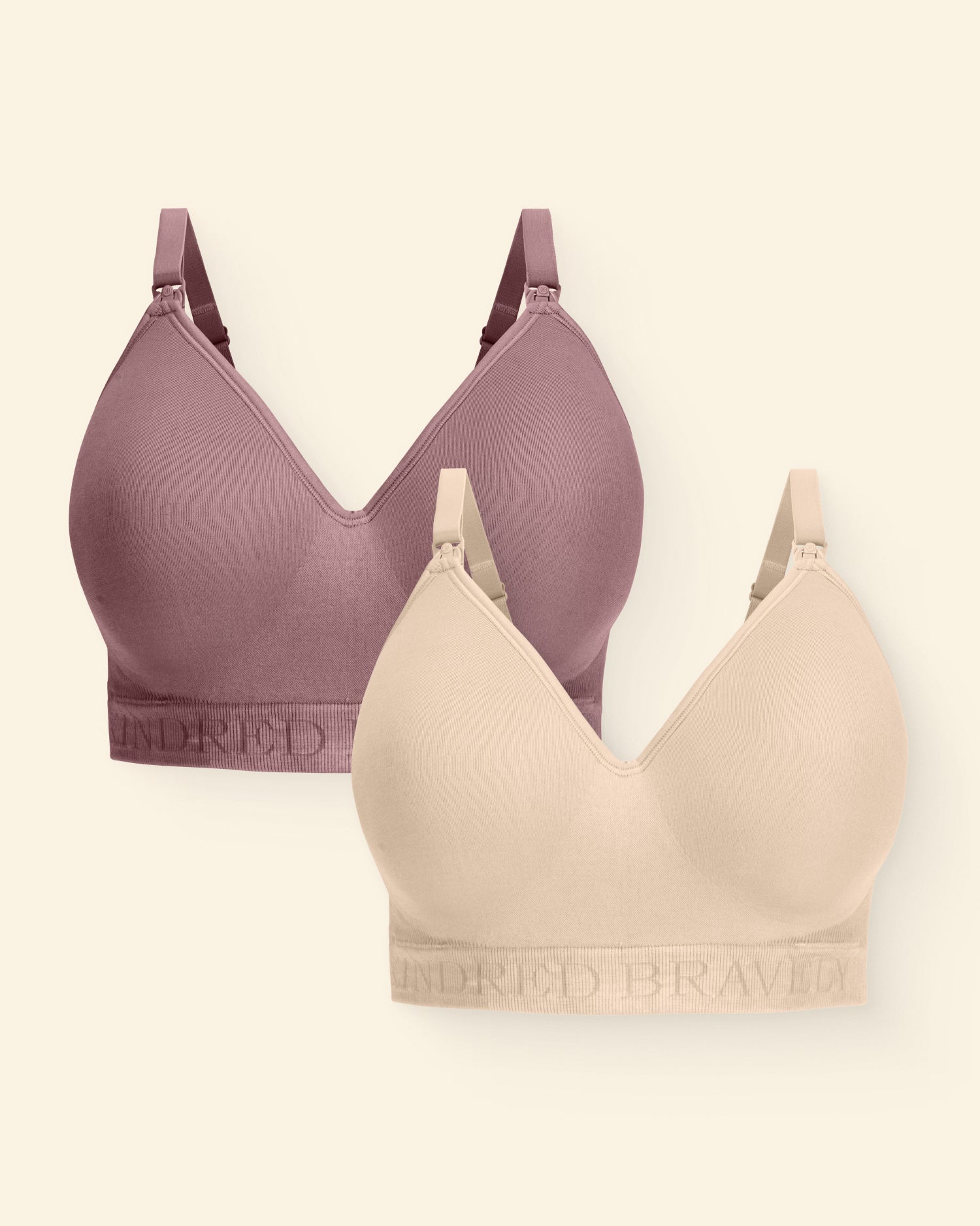 Two bras, one purple and one beige, on a light beige background