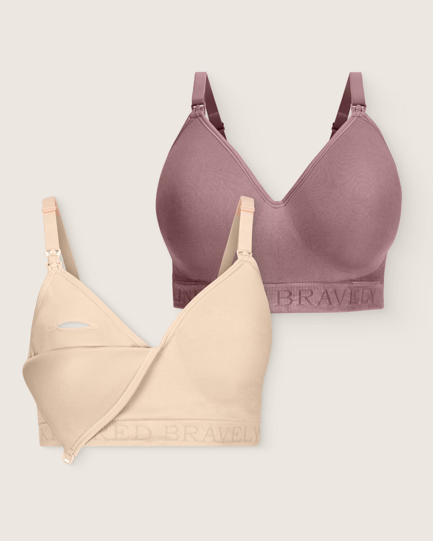 Two bras, one purple and one beige, on a light gray background.