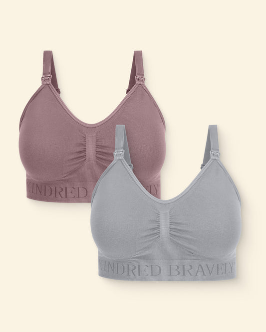 Two bras, one purple and one gray on a beige background.