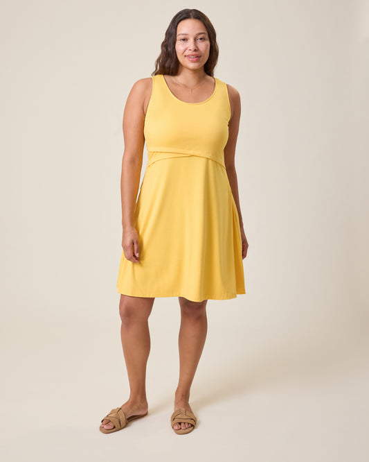 Woman wearing a yellow dress against a plain background@model_info:Alana is 5'7" and wearing a Large.