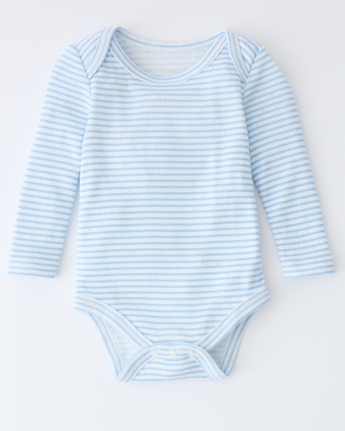 Pointelle Long Sleeve Onesie in Blue Candy Stripe on a beige background.