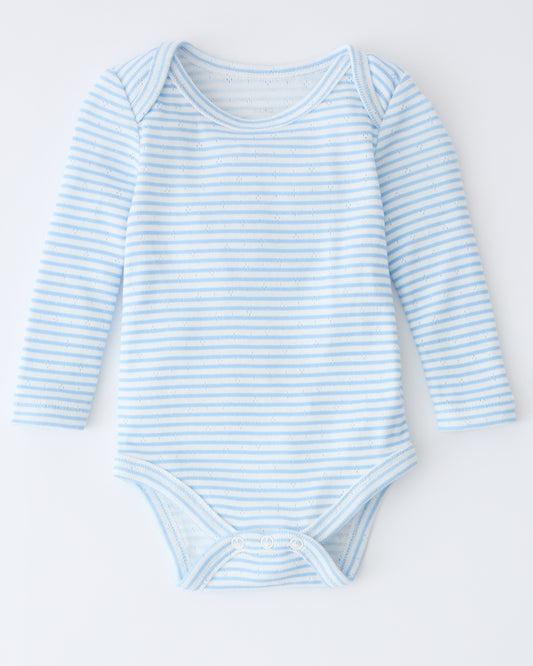 Pointelle Long Sleeve Onesie in Blue Candy Stripe on a beige background.
