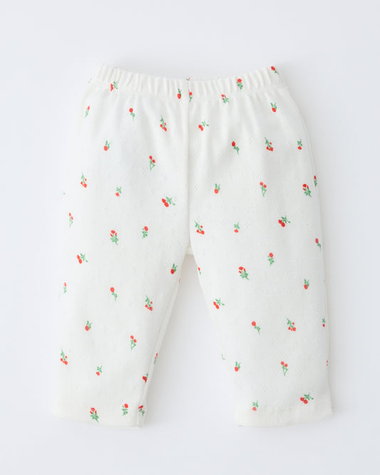Pointelle Leggings in Dainty Ditsy pattern on a beige background.