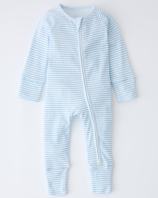 Pointelle Sleeper Pajama in Blue Candy Stripe on a beige background.