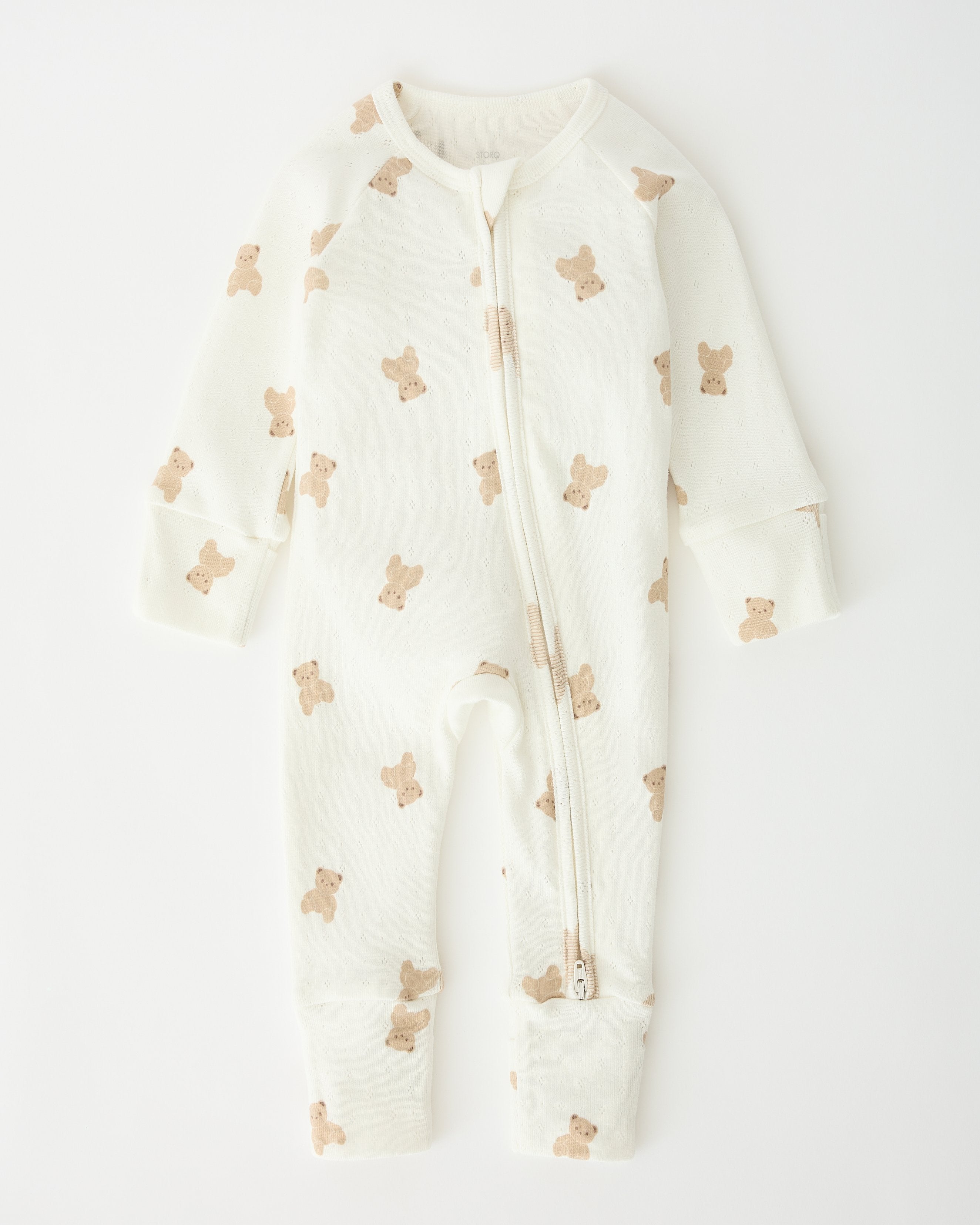 Pointelle Baby Pajama in Ivory Bears pattern laid flat on an off white background.