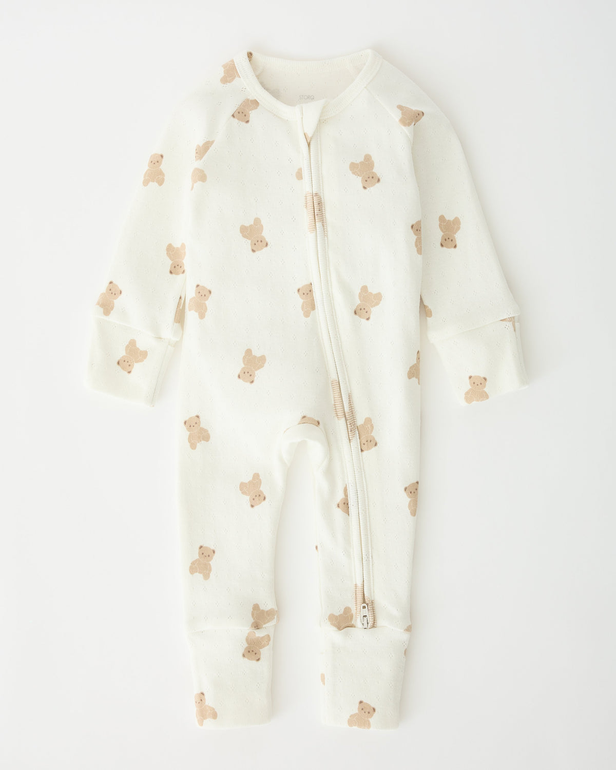 Pointelle Baby Pajama in Ivory Bears pattern laid flat on an off white background.