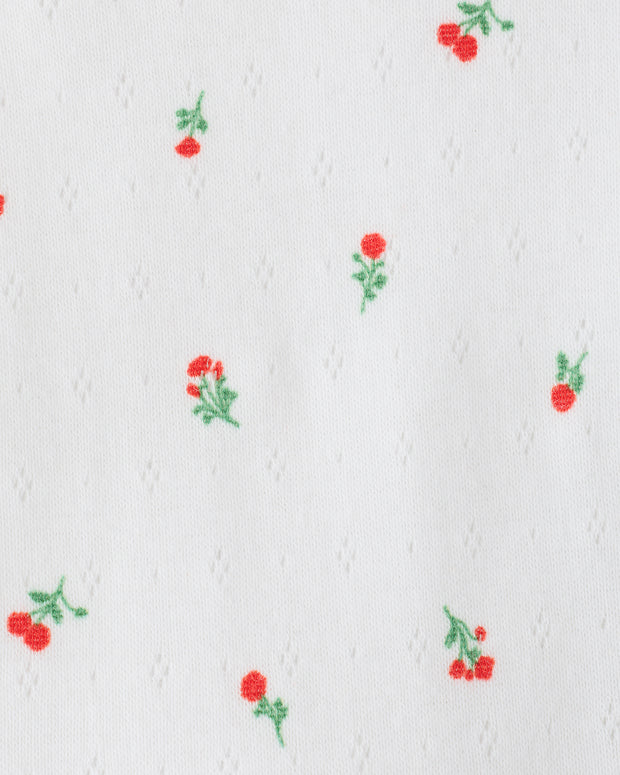 Close up of the pattern and fabric of the Pointelle Long Sleeve Onesie in Dainty Ditsy pattern.