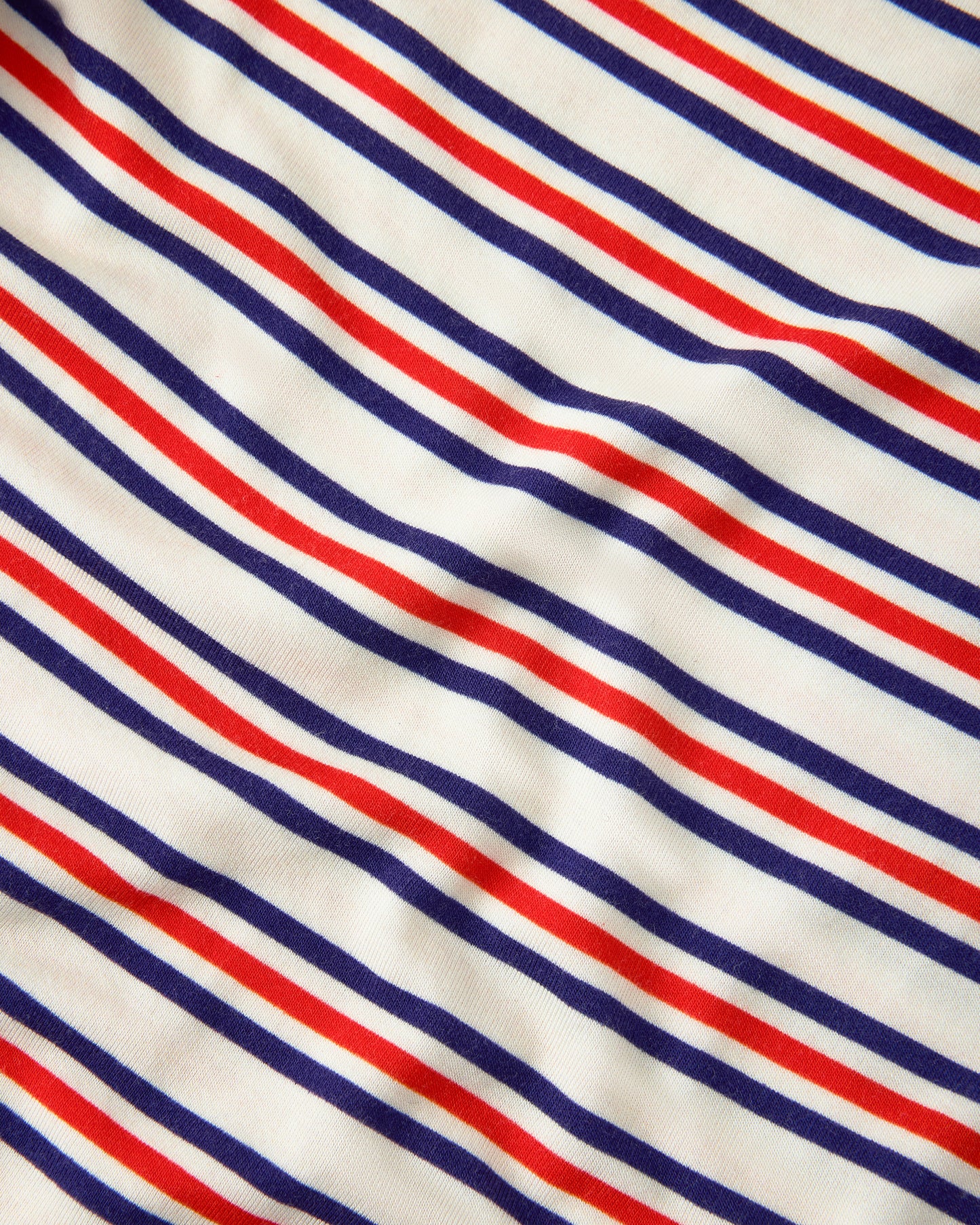 Close up of pattern on Baby Onesie Two-Pack in Red & Blue Stripe