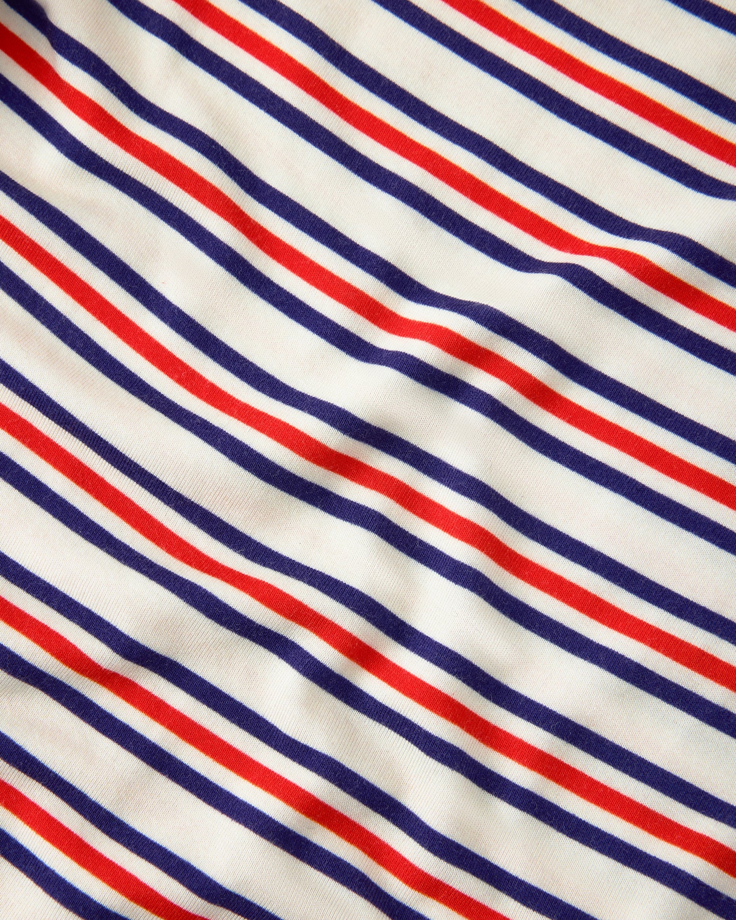 Close up of pattern on Baby Onesie Two-Pack in Red & Blue Stripe