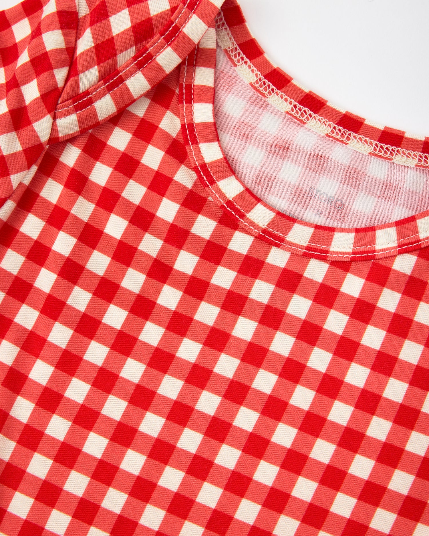 Close up of collar on Baby Onesie Two-Pack in Red & Blue Gingham