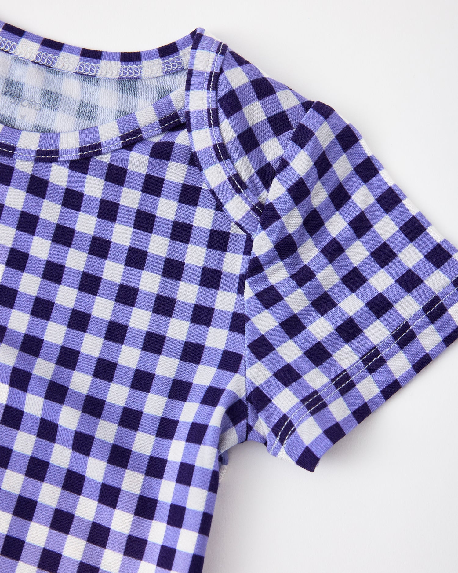 Close up of collar on Baby Onesie Two-Pack in Red & Blue Gingham