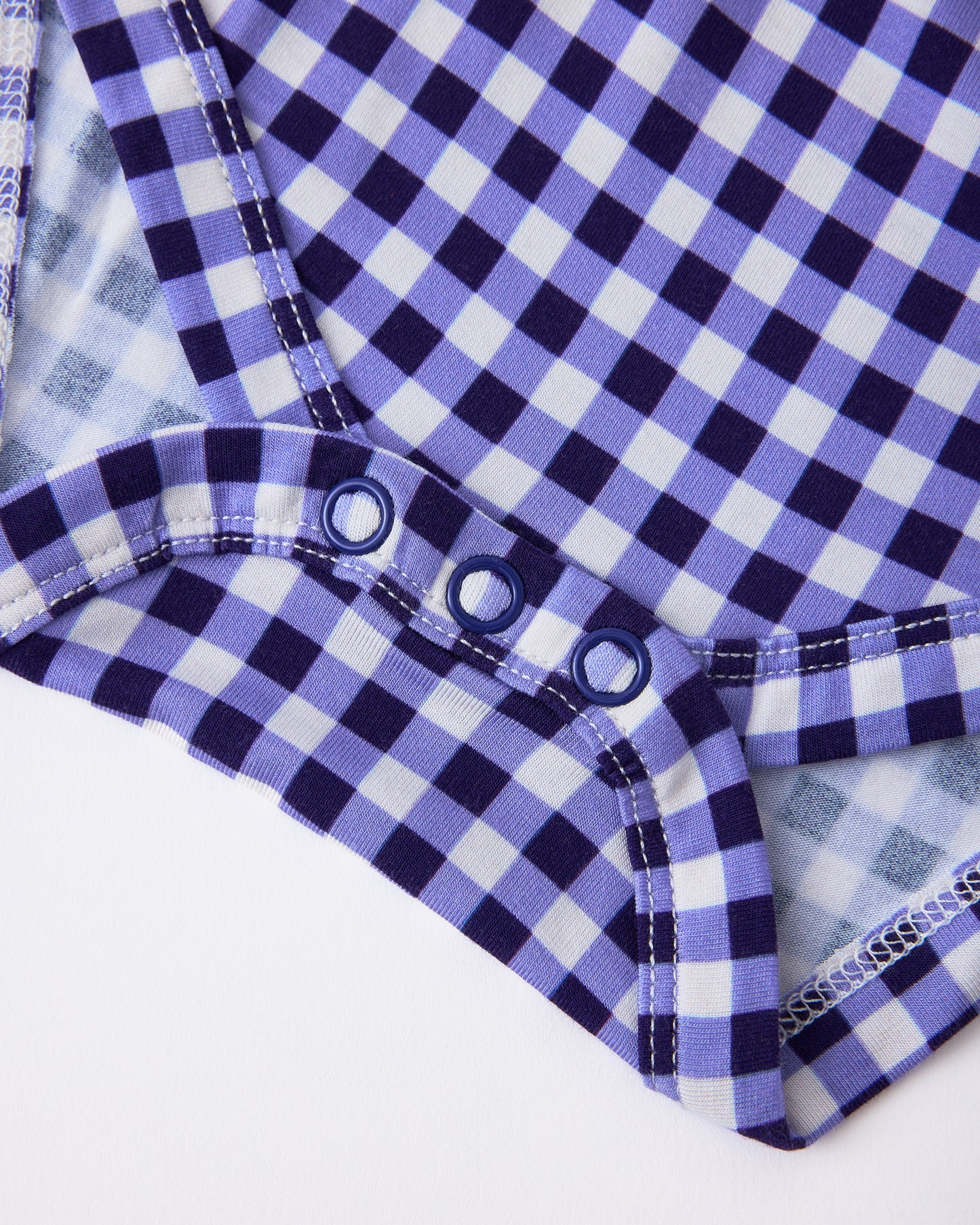 Close up of snaps on Baby Onesie Two-Pack in Red & Blue Gingham