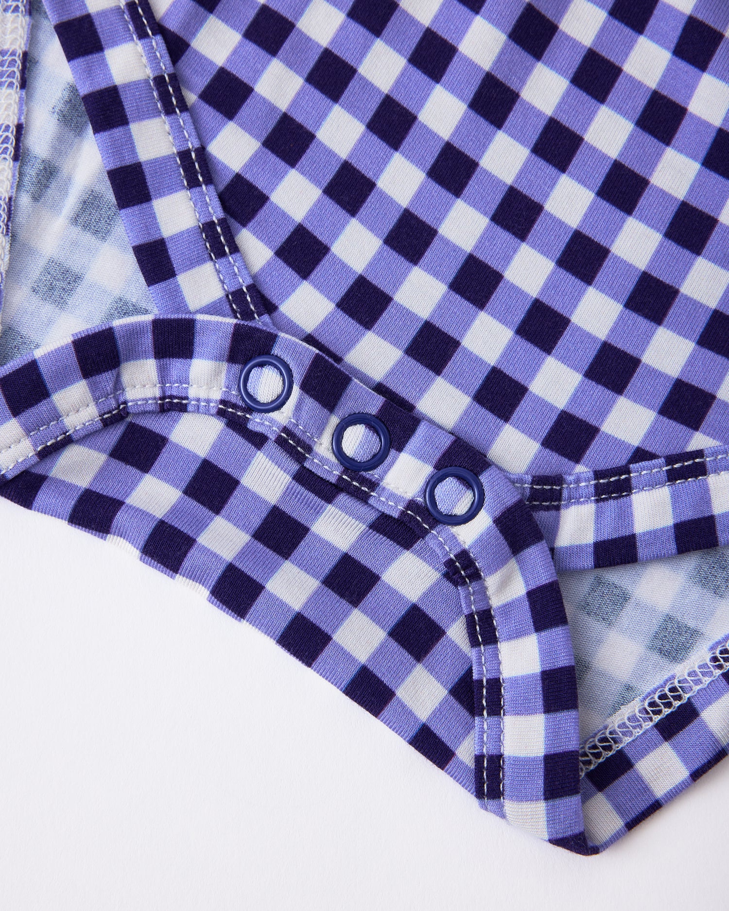 Close up of snaps on Baby Onesie Two-Pack in Red & Blue Gingham