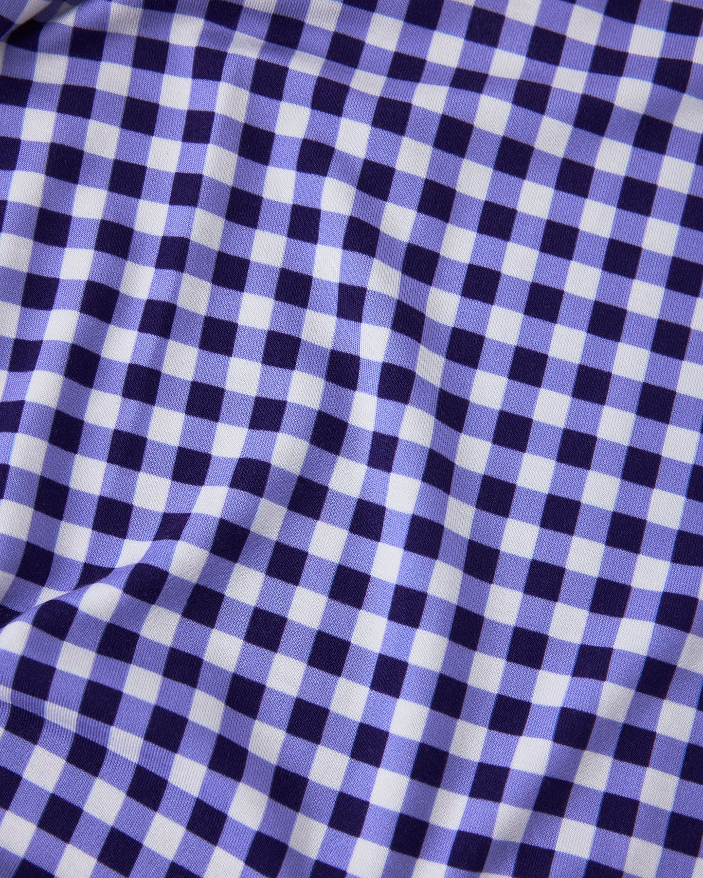 Close up of pattern on Baby Onesie Two-Pack in Red & Blue Gingham