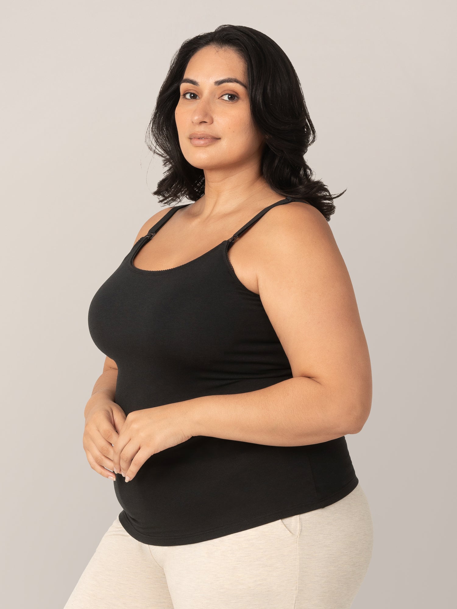 3/4 view of model wearing the Picot Trim Nursing Camisole in Black.