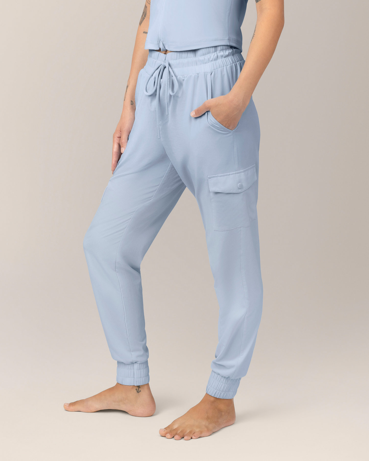 Side view of Model wearing the Remy Maternity & Postpartum Cargo Jogger in French Blue
