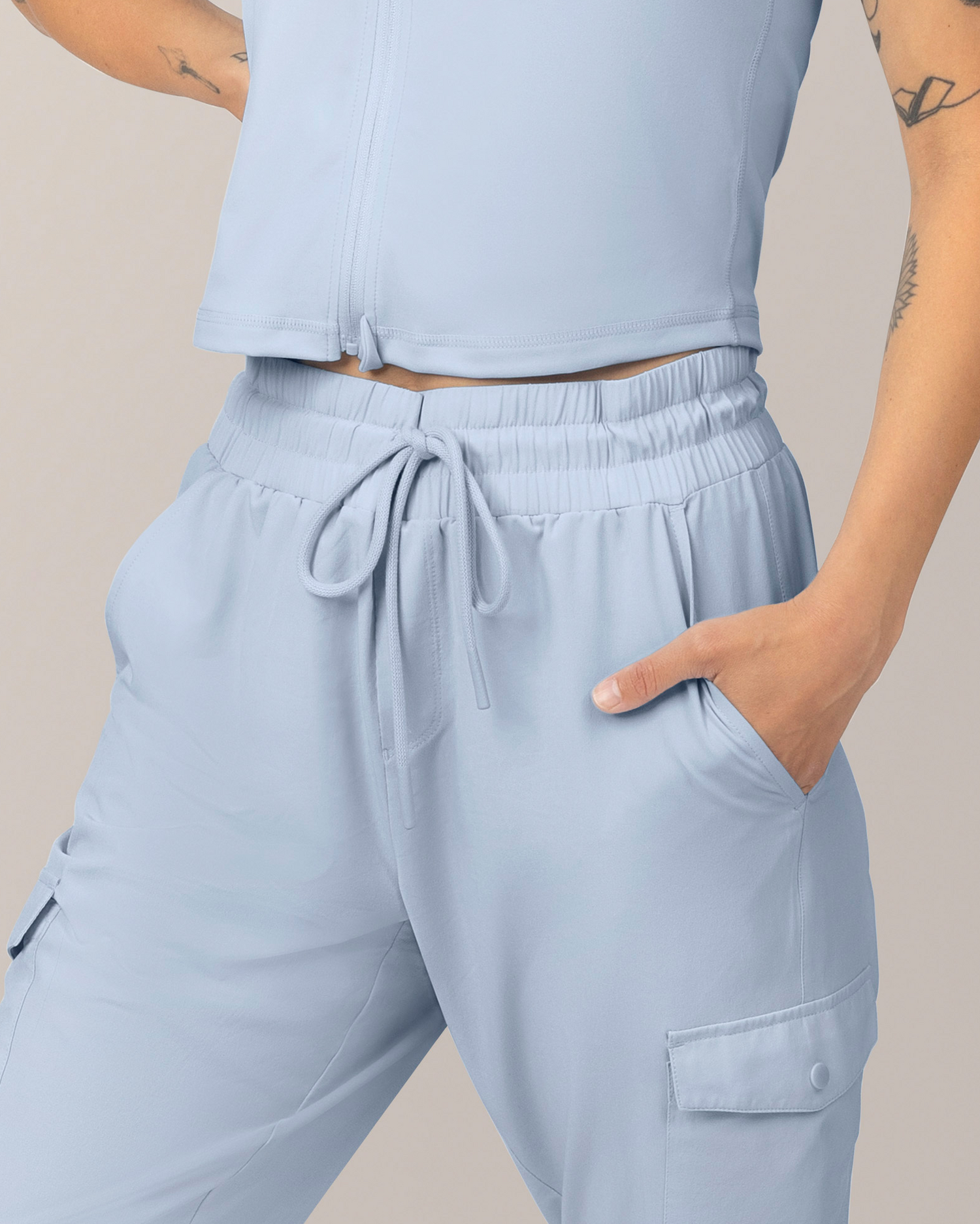 Detail view of Model wearing the Remy Maternity & Postpartum Cargo Jogger in French Blue