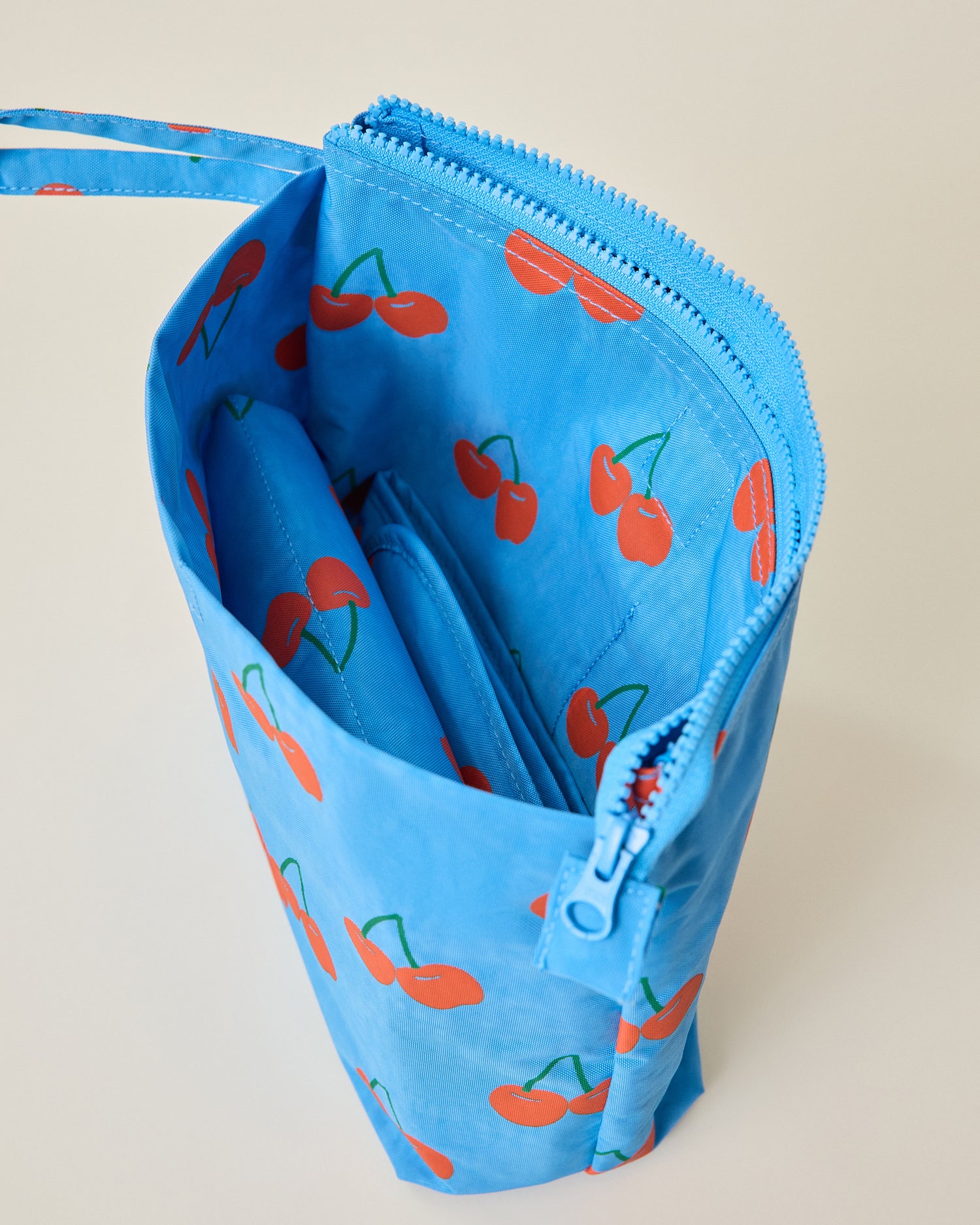 Quick Change Kit Bag unzipped in Blue Cherries