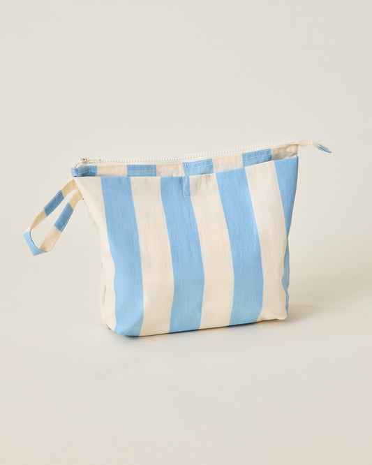 Quick Change Kit Bag in Blue Wide Stripe pattern on a beige background