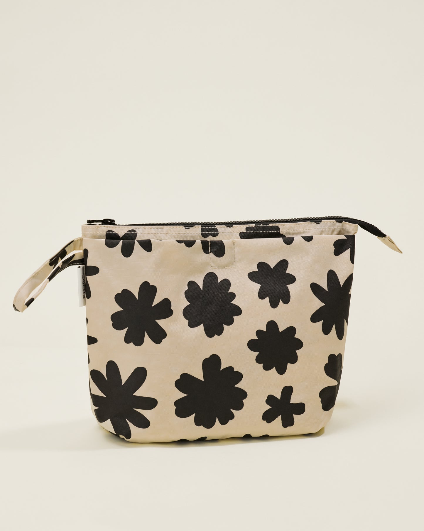 Quick Change Kit Bag in Cream Chamomiles print, on a neutral background