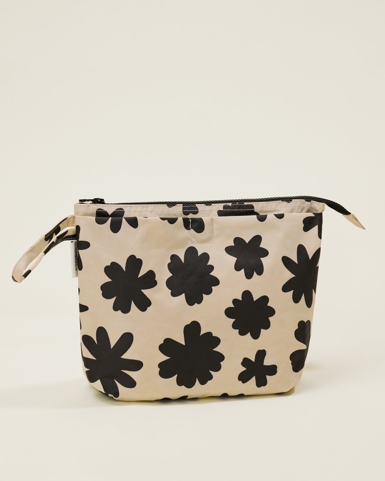 Quick Change Kit Bag in Cream Chamomiles print, on a neutral background