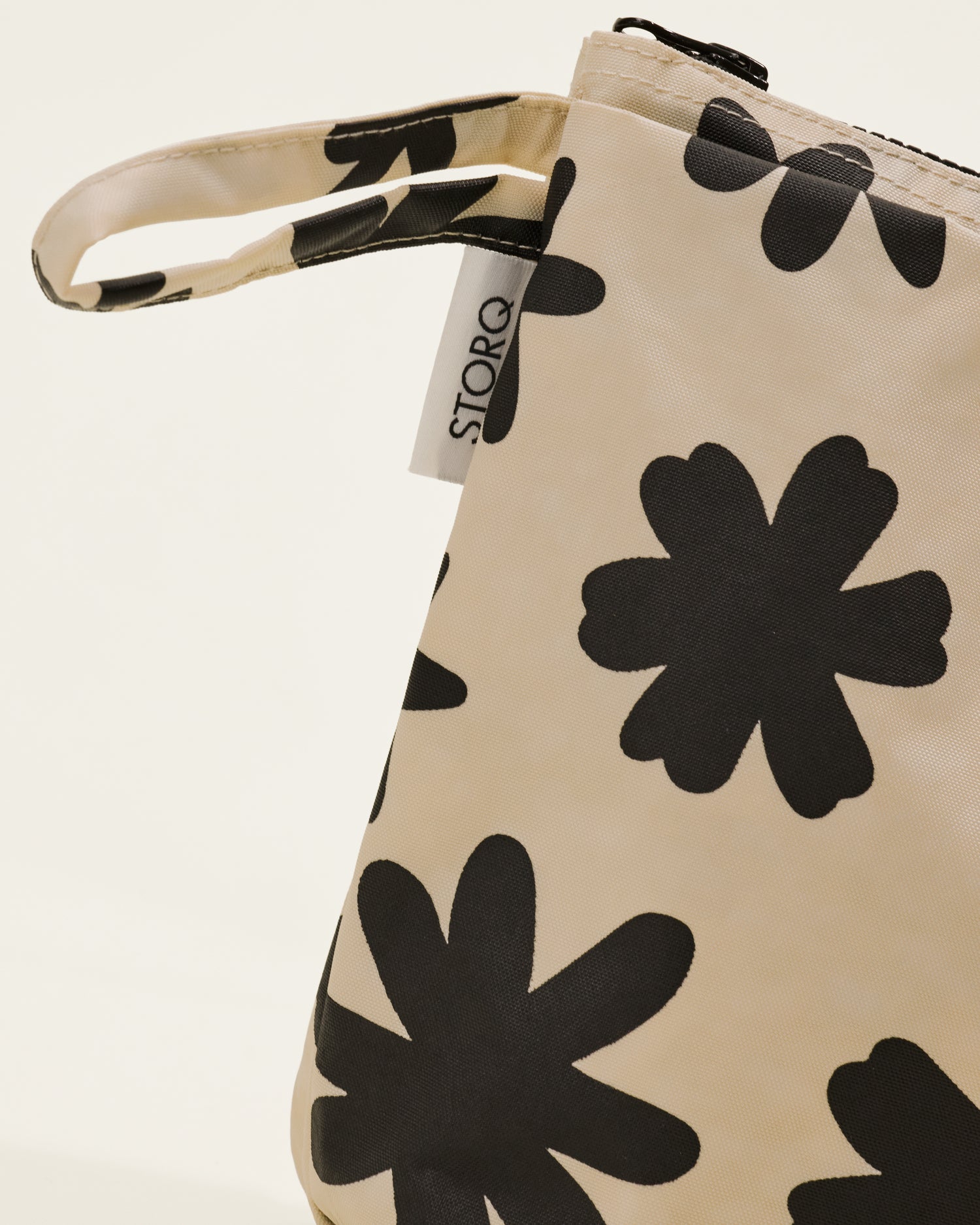 Close up of Quick Change Kit Bag in Cream Chamomiles print