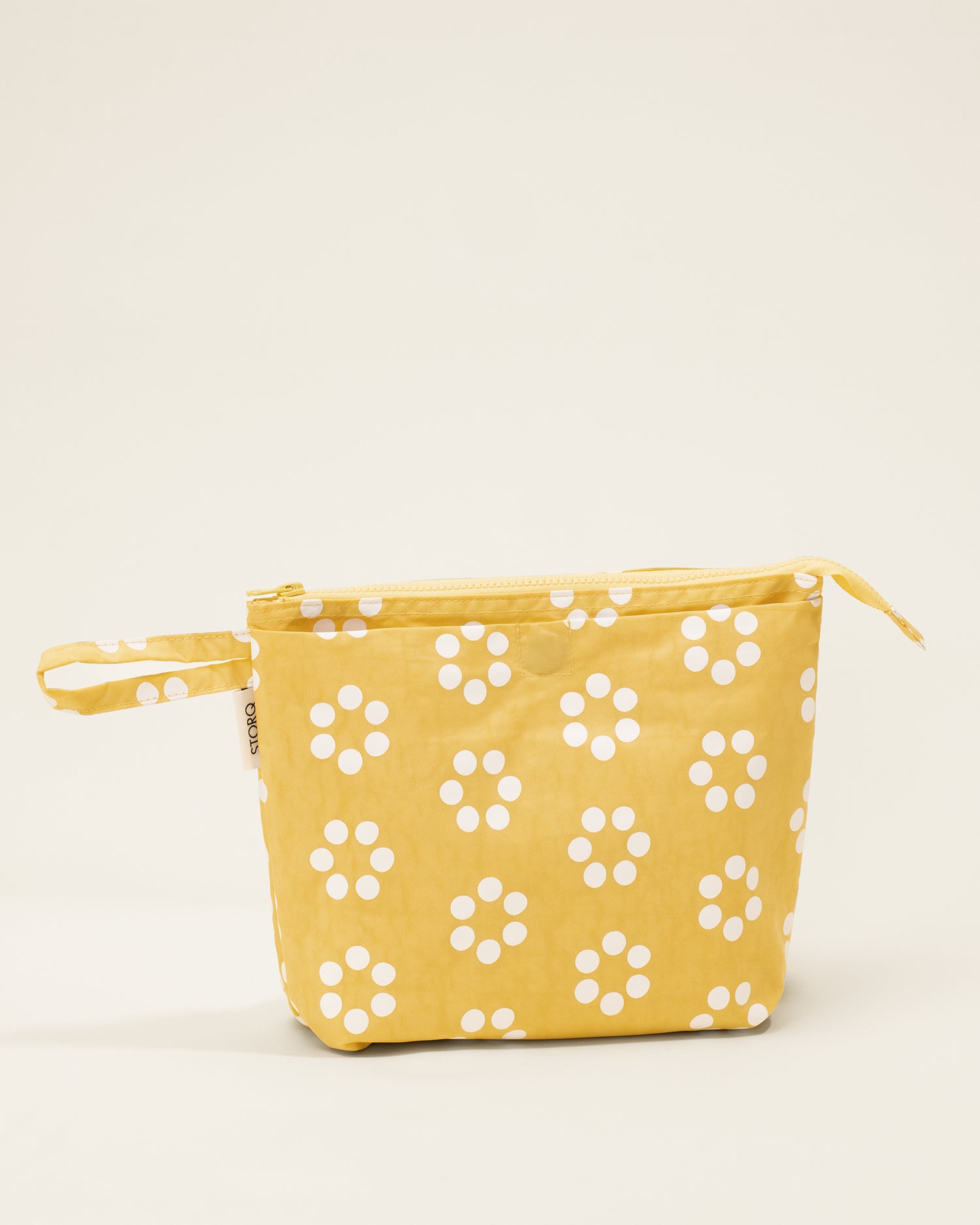 Quick Change Kit Bag in Sunshine Dots print, on a neutral background